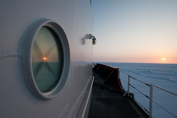 The sun sets over the sea ice on the Bering Sea.